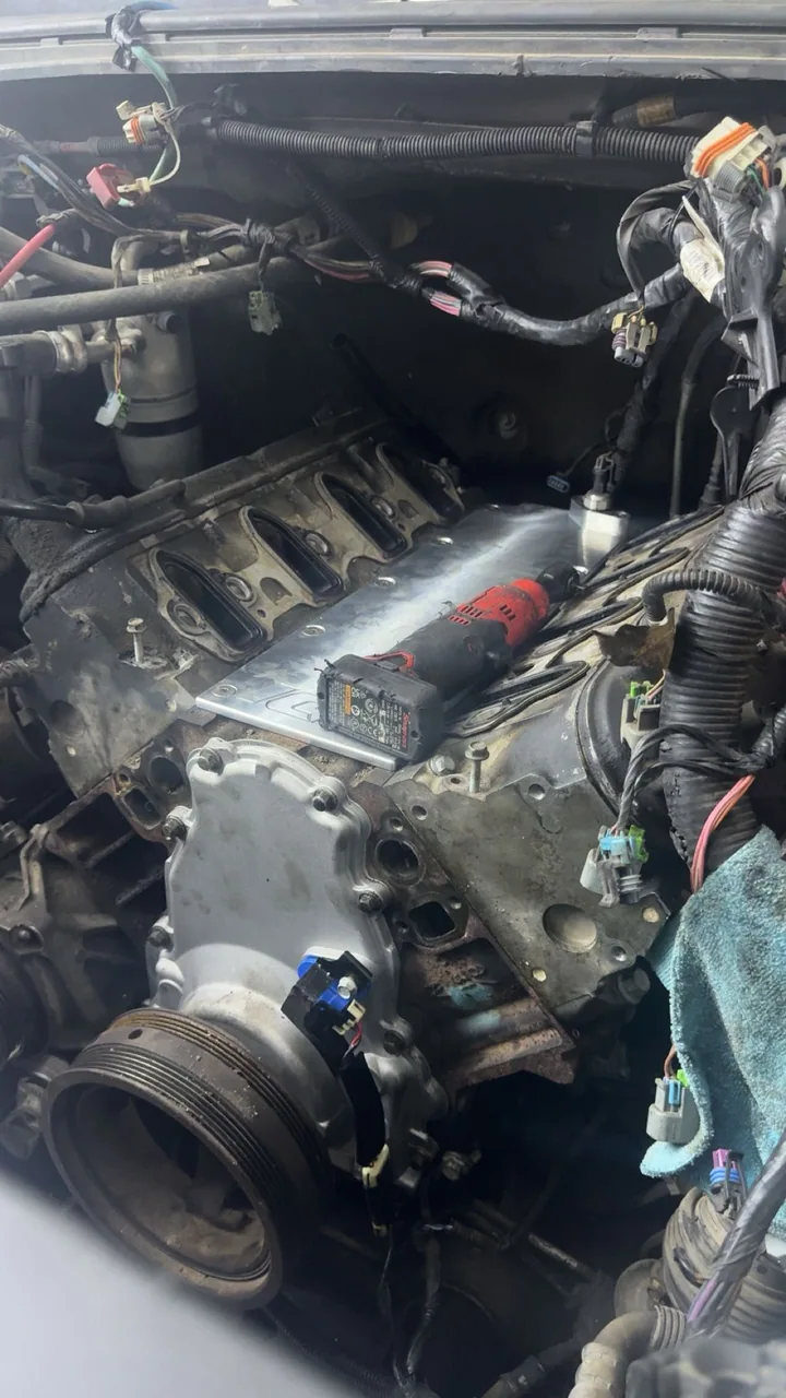 Engine block and timing cover during work in the bay