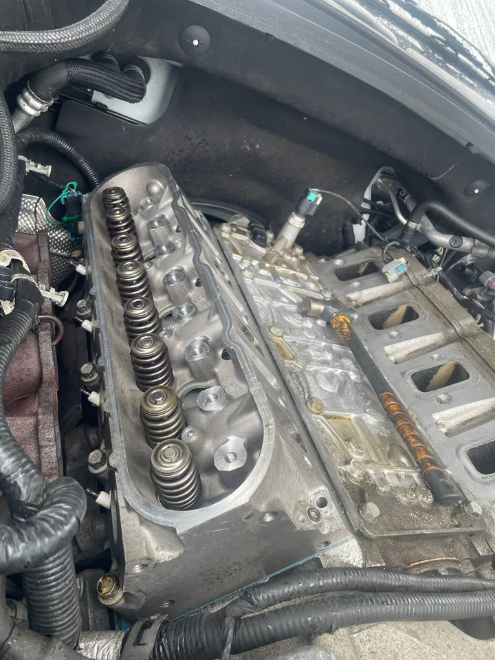 Close-up of cylinder heads and valve springs in an engine bay